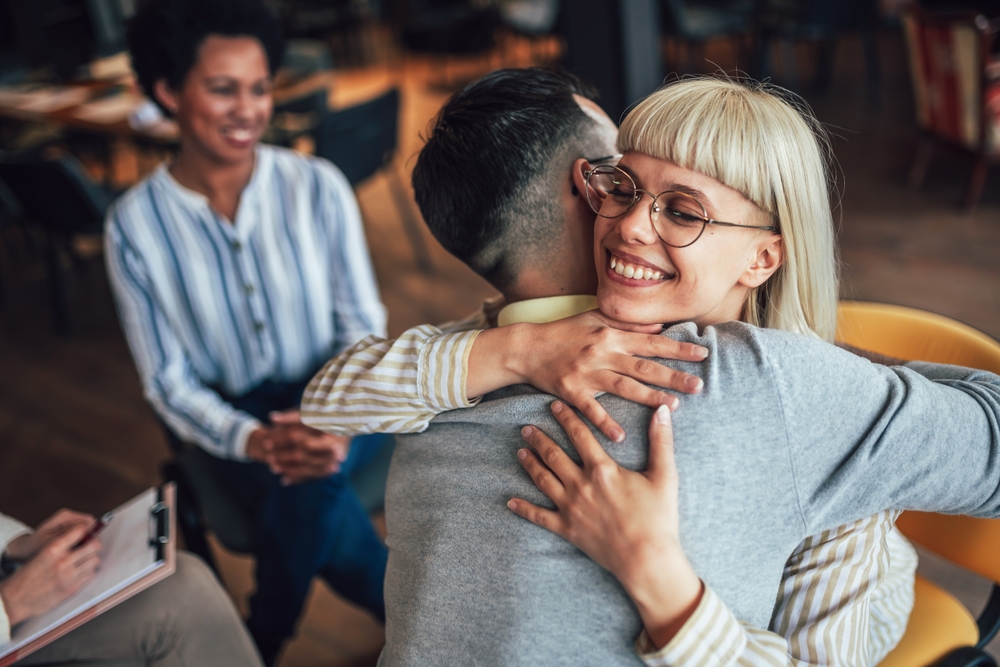 Support,Group,Patients,Hug,Each,Other,During,The,Therapy,Session.