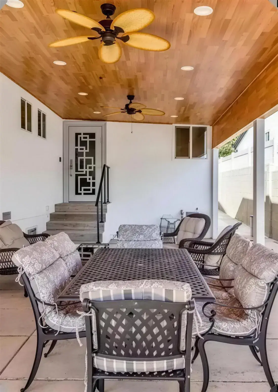 Covered back patio with outdoor seating