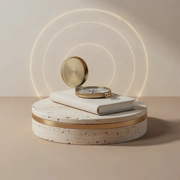 A gold compass on a notebook: planning the next step before discharge